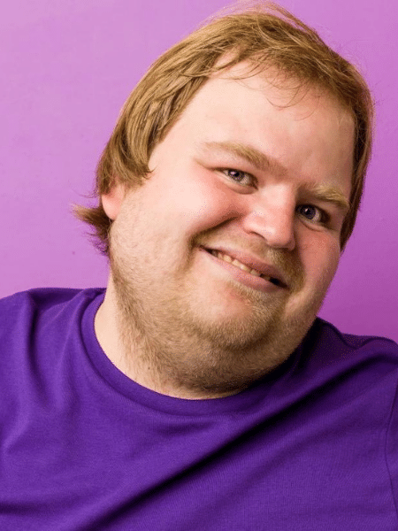 Happy disabled man smiling at camera