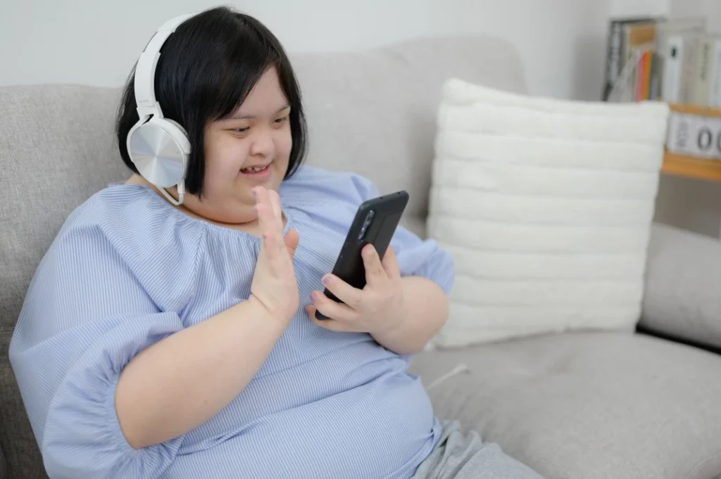 Disabled woman using phone to make video call